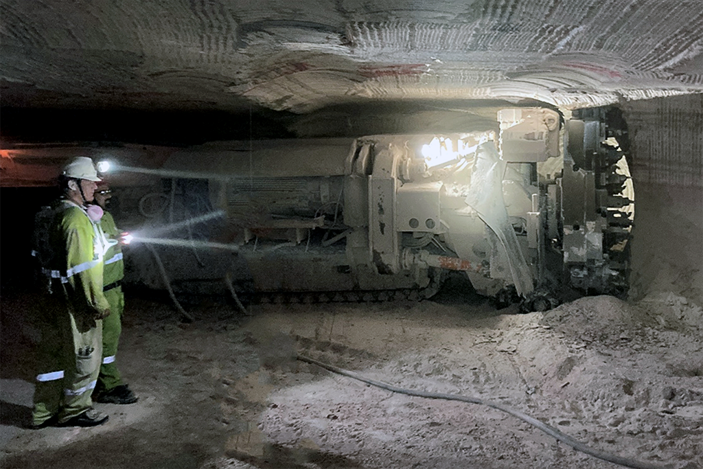 Miner in action underground